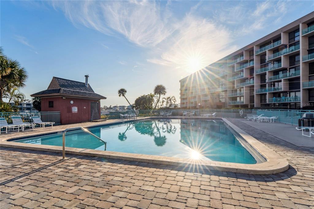 1 Key Capri, Unit 312E Treasure Island, FL 33706 - Photo 65 of 86 a view of swimming pool with outdoor seating