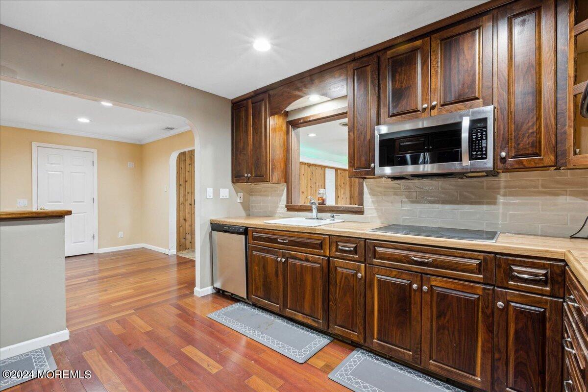 490 Iron Bridge Road Freehold, NJ 07728 - Photo 12 of 40 a kitchen with stainless steel appliances granite countertop a sink and a microwave