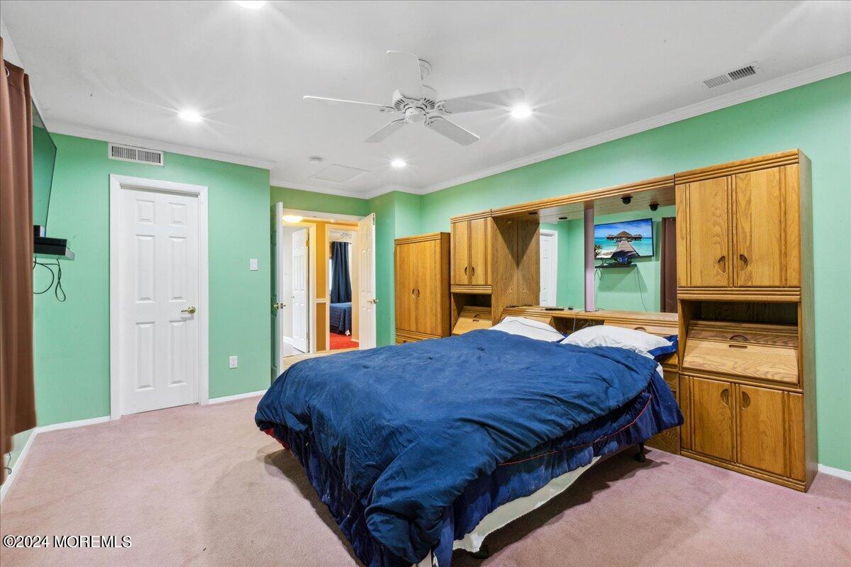 490 Iron Bridge Road Freehold, NJ 07728 - Photo 19 of 40 a bedroom with a bed next to a window