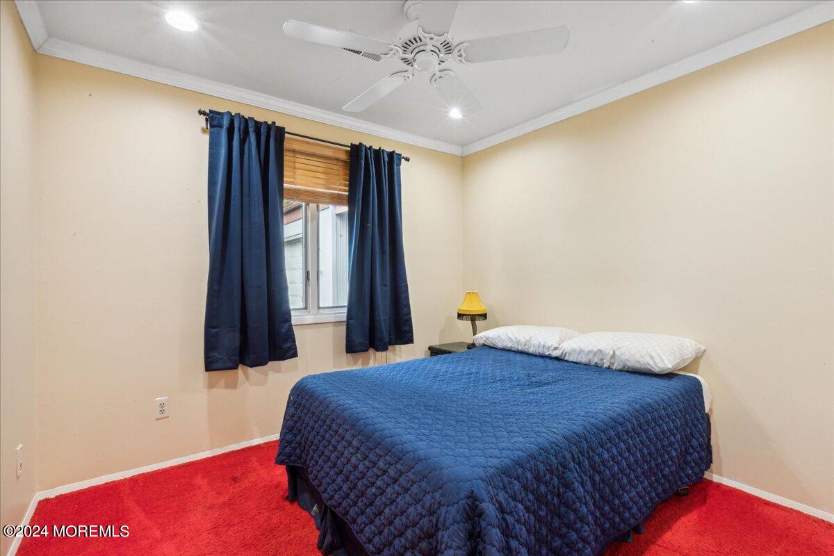 490 Iron Bridge Road Freehold, NJ 07728 - Photo 22 of 40 a bedroom with a bed and a window