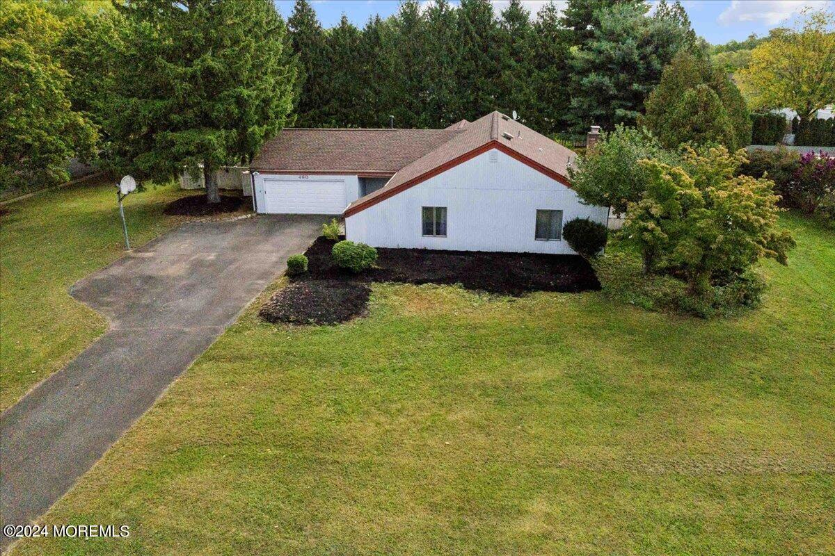490 Iron Bridge Road Freehold, NJ 07728 - Photo 27 of 40 a house view with a garden space