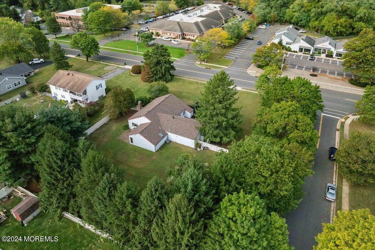 490 Iron Bridge Road Freehold, NJ 07728 - Photo 32 of 40 an aerial view of residential house with outdoor space and trees all around