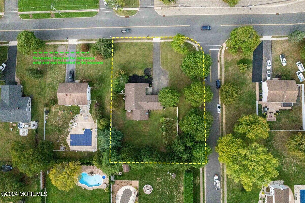 490 Iron Bridge Road Freehold, NJ 07728 - Photo 39 of 40 an aerial view of a house with swimming pool and garden