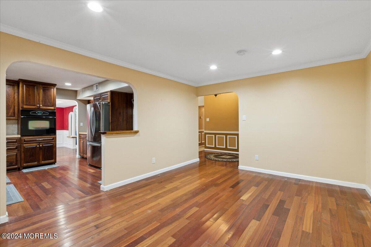 490 Iron Bridge Road Freehold, NJ 07728 - Photo 6 of 40 a view of empty room with wooden floor