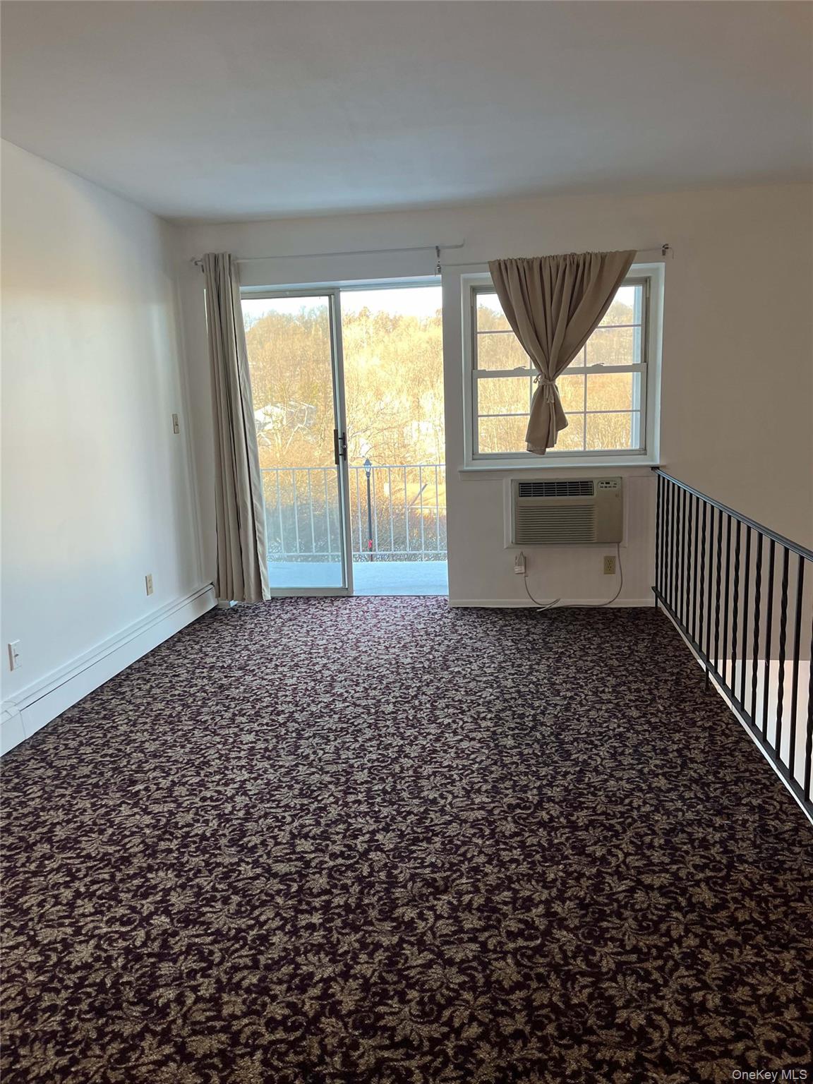 1840 Crompond Road, Unit 9B7 Peekskill, NY 10566 - Photo 2 of 7 wooden floor in an empty room with a window