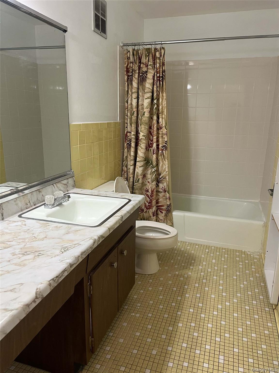 1840 Crompond Road, Unit 9B7 Peekskill, NY 10566 - Photo 6 of 7 a bathroom with a granite countertop sink a toilet and shower