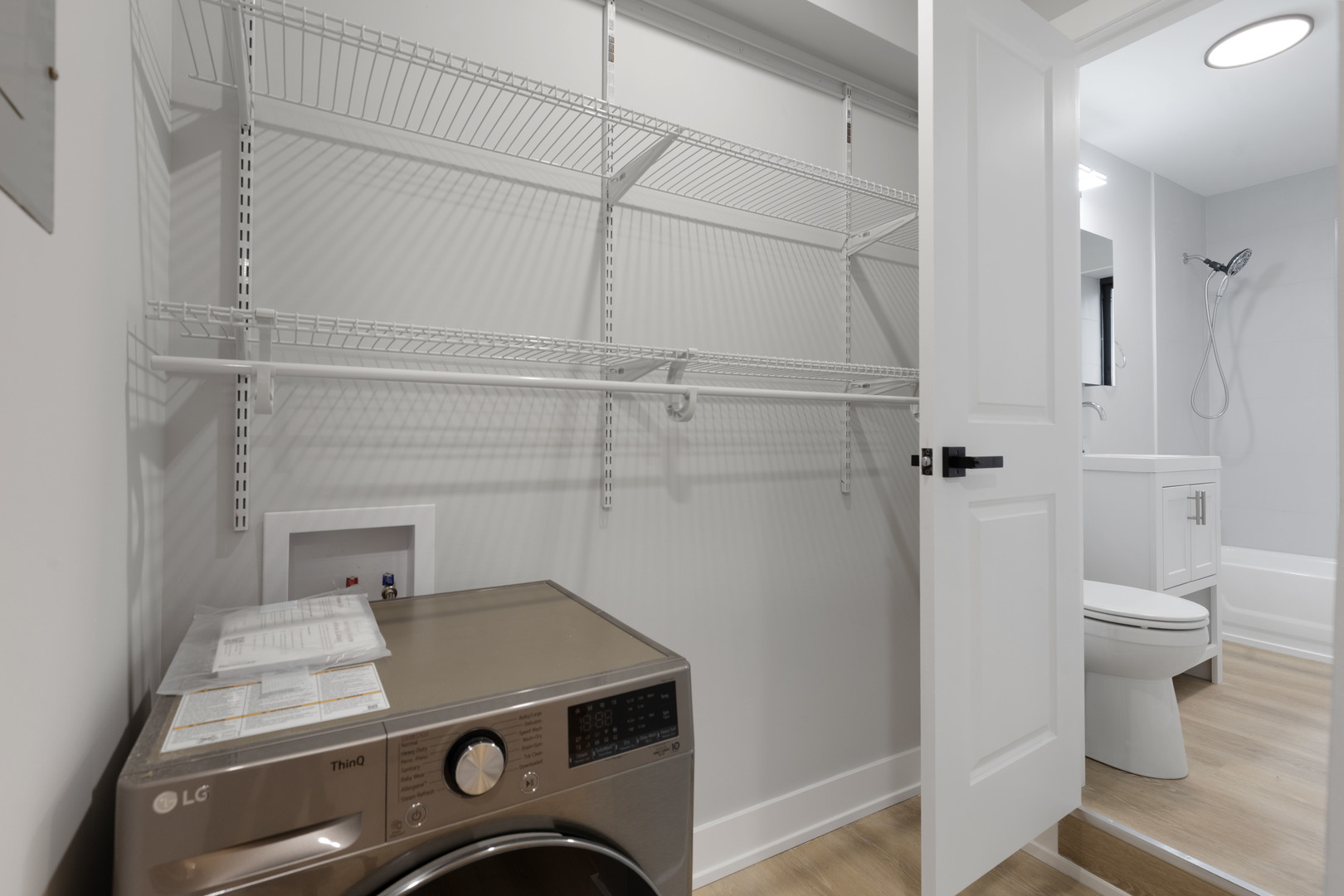 1634 West Howard Street, Unit 208 Chicago, IL 60626 - Photo 5 of 6 a utility room with a washer and dryer