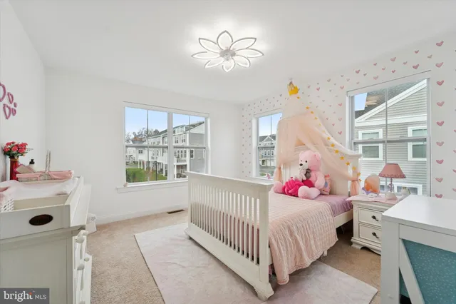 a bedroom with furniture and a baby crib
