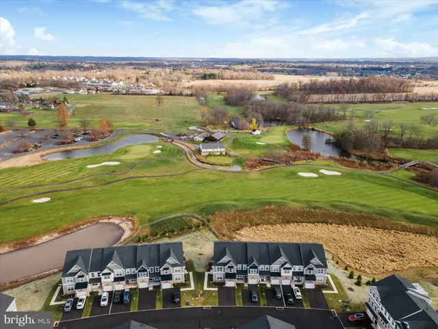 an aerial view of a city with lawn chairs