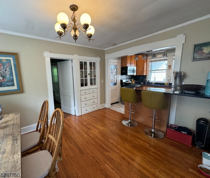 226 Park Street, Unit 2 Montclair, NJ 07042 - Photo 12 of 24 a view of a dining room with furniture wooden floor and chandelier