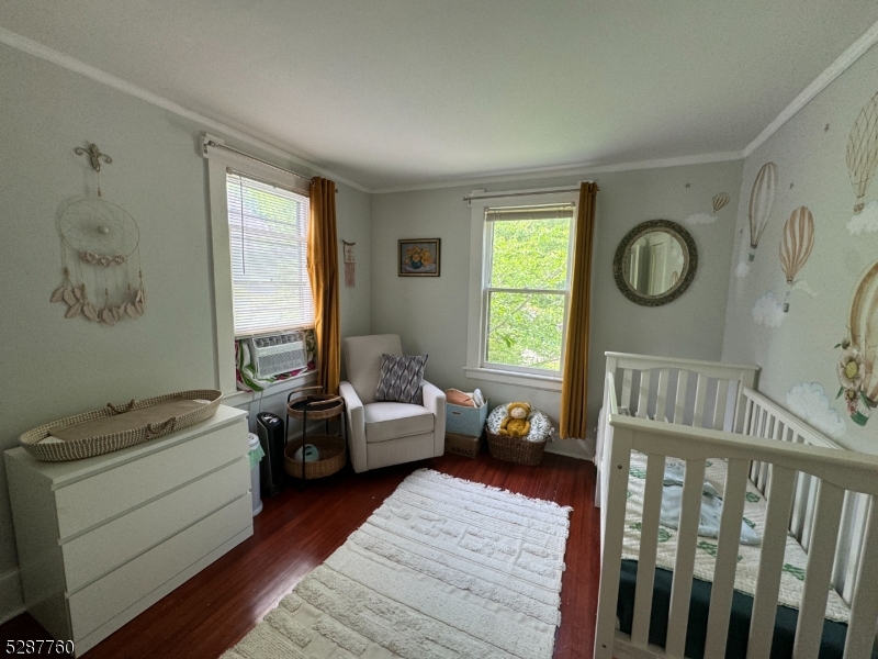 226 Park Street, Unit 2 Montclair, NJ 07042 - Photo 15 of 24 a living room with furniture stairs and a window