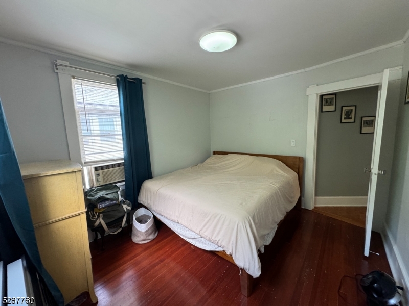 226 Park Street, Unit 2 Montclair, NJ 07042 - Photo 17 of 24 a bedroom with a bed and wooden floor