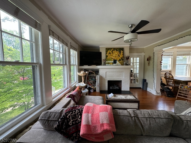 226 Park Street, Unit 2 Montclair, NJ 07042 - Photo 2 of 24 a living room with furniture large window and a fireplace