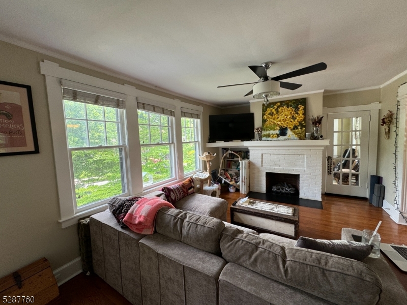 226 Park Street, Unit 2 Montclair, NJ 07042 - Photo 23 of 24 a living room with furniture and a fireplace