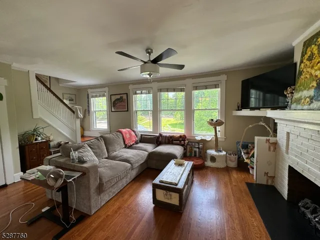 a living room with furniture fireplace and a flat screen tv