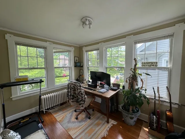 a workspace with furniture and a window