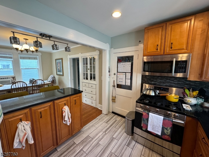 226 Park Street, Unit 2 Montclair, NJ 07042 - Photo 9 of 24 a kitchen with stainless steel appliances granite countertop a stove and a sink
