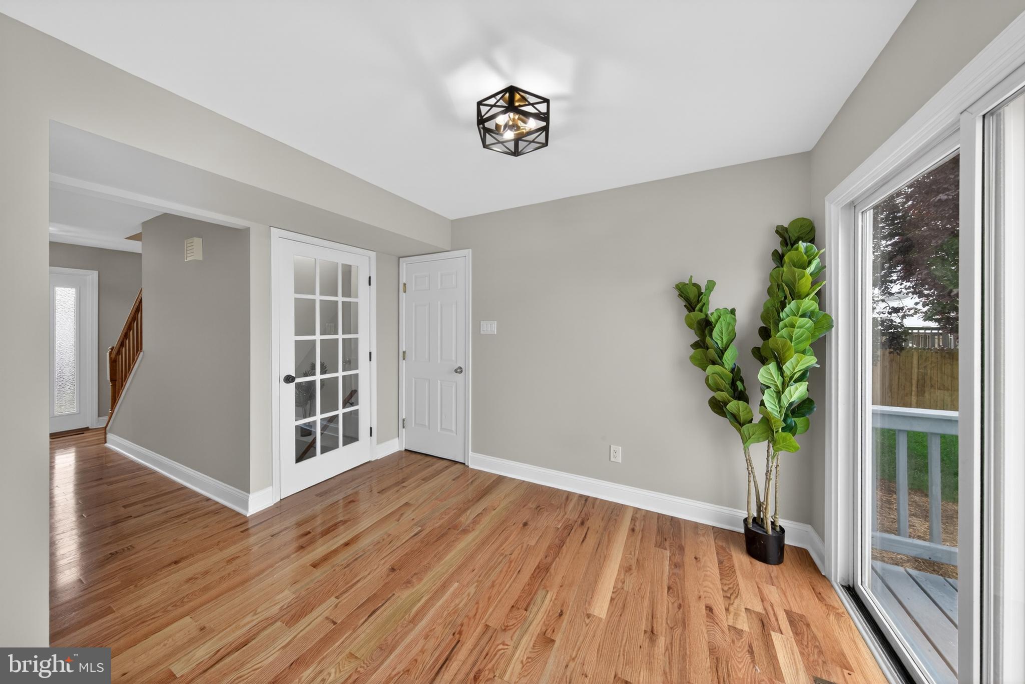 20 Baywatch Road New Castle, DE 19720 - Photo 35 of 76 a view of a hallway with wooden floor and a potted plant