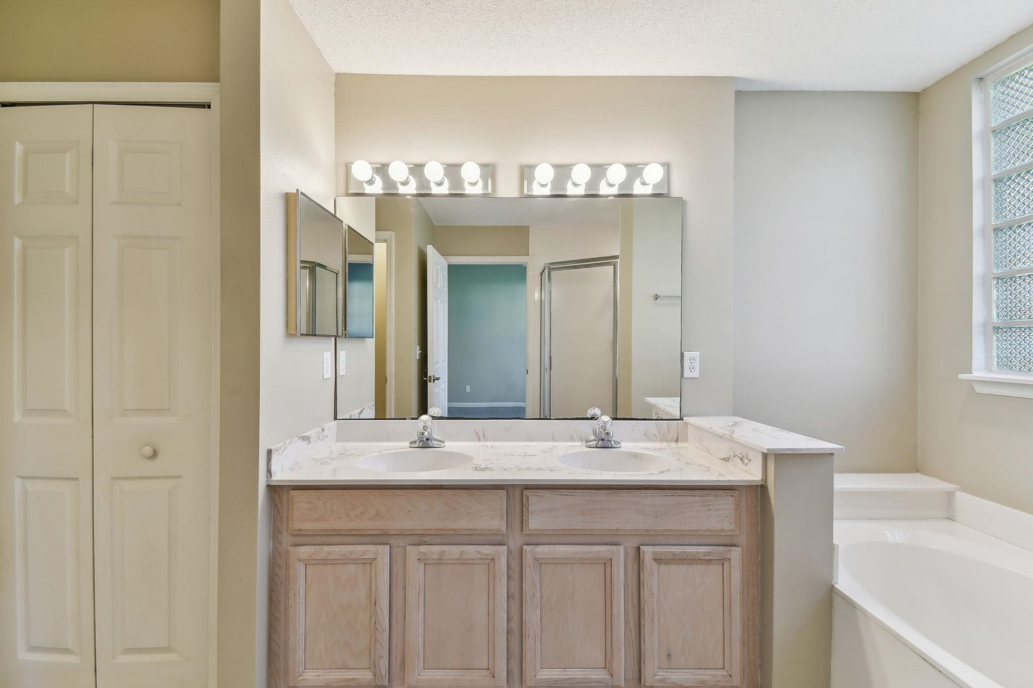 202 Augusta Circle St. Augustine, FL 32086 - Photo 22 of 35 a bathroom with a sink and a mirror