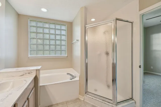 a view of a bathroom with a shower and a door
