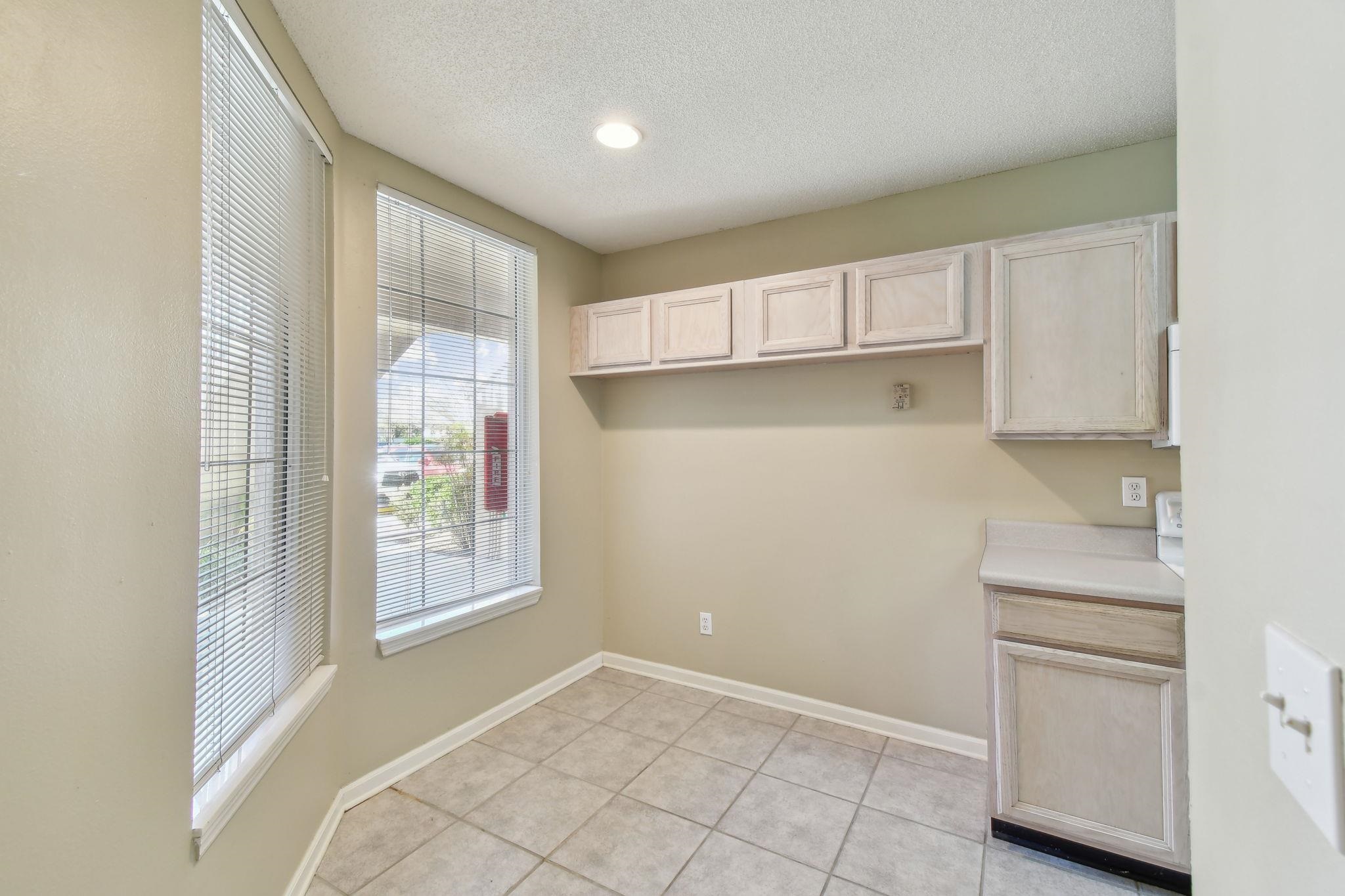 202 Augusta Circle St. Augustine, FL 32086 - Photo 4 of 35 a view of an empty room with a kitchen