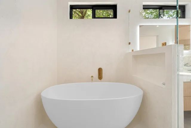 a white bath tub sitting in a bathroom