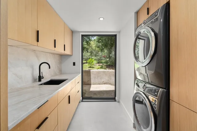 a view of a kitchen with washer and dryer