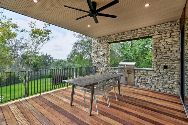 a view of a balcony with furniture