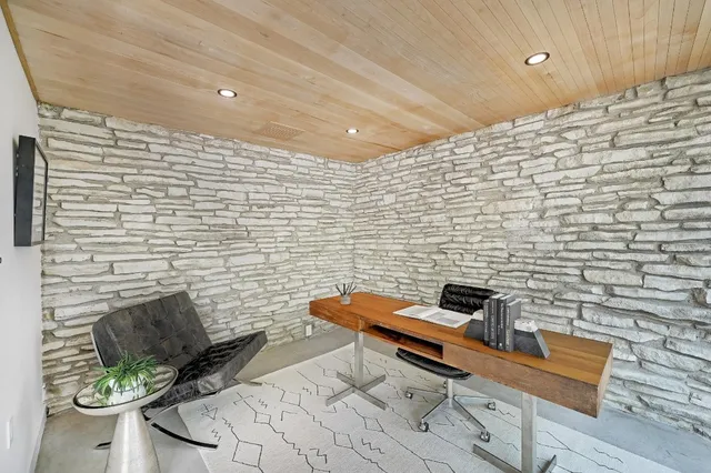 a backyard of a house with furniture