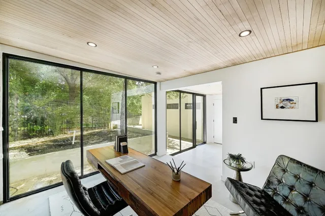 a room with furniture and a large window