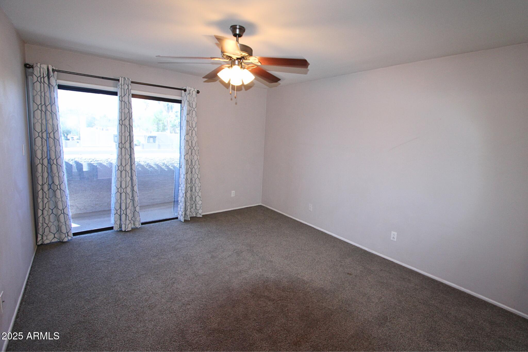 885 North Granite Reef Road, Unit 63 Scottsdale, AZ 85257 - Photo 12 of 23 wooden floor in an empty room with a window