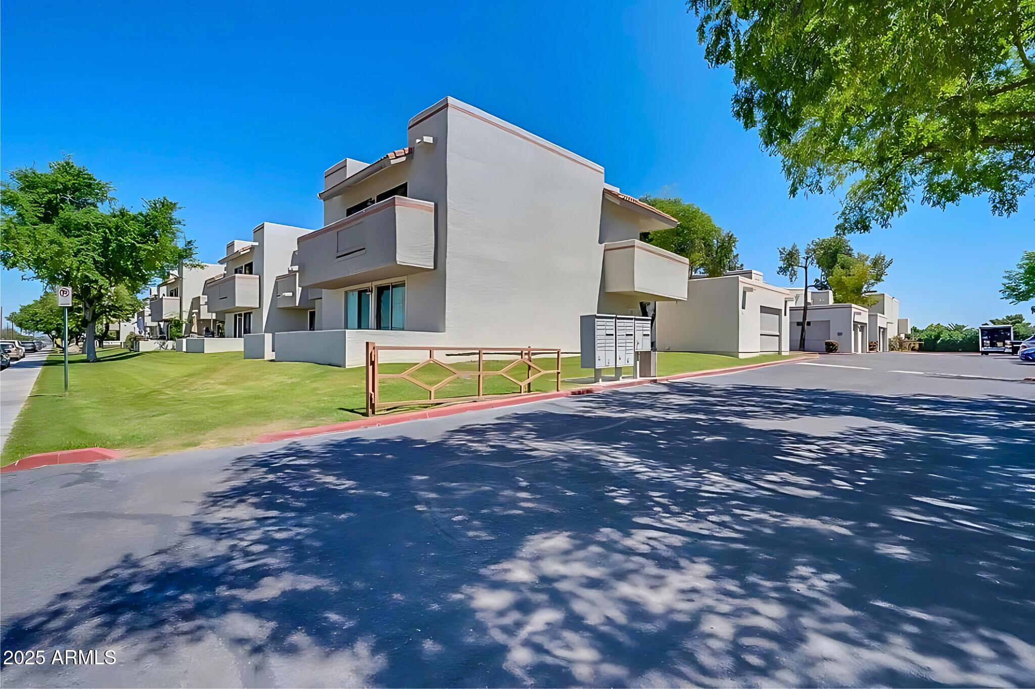 885 North Granite Reef Road, Unit 63 Scottsdale, AZ 85257 - Photo 18 of 23 a view of a house with backyard and a tree