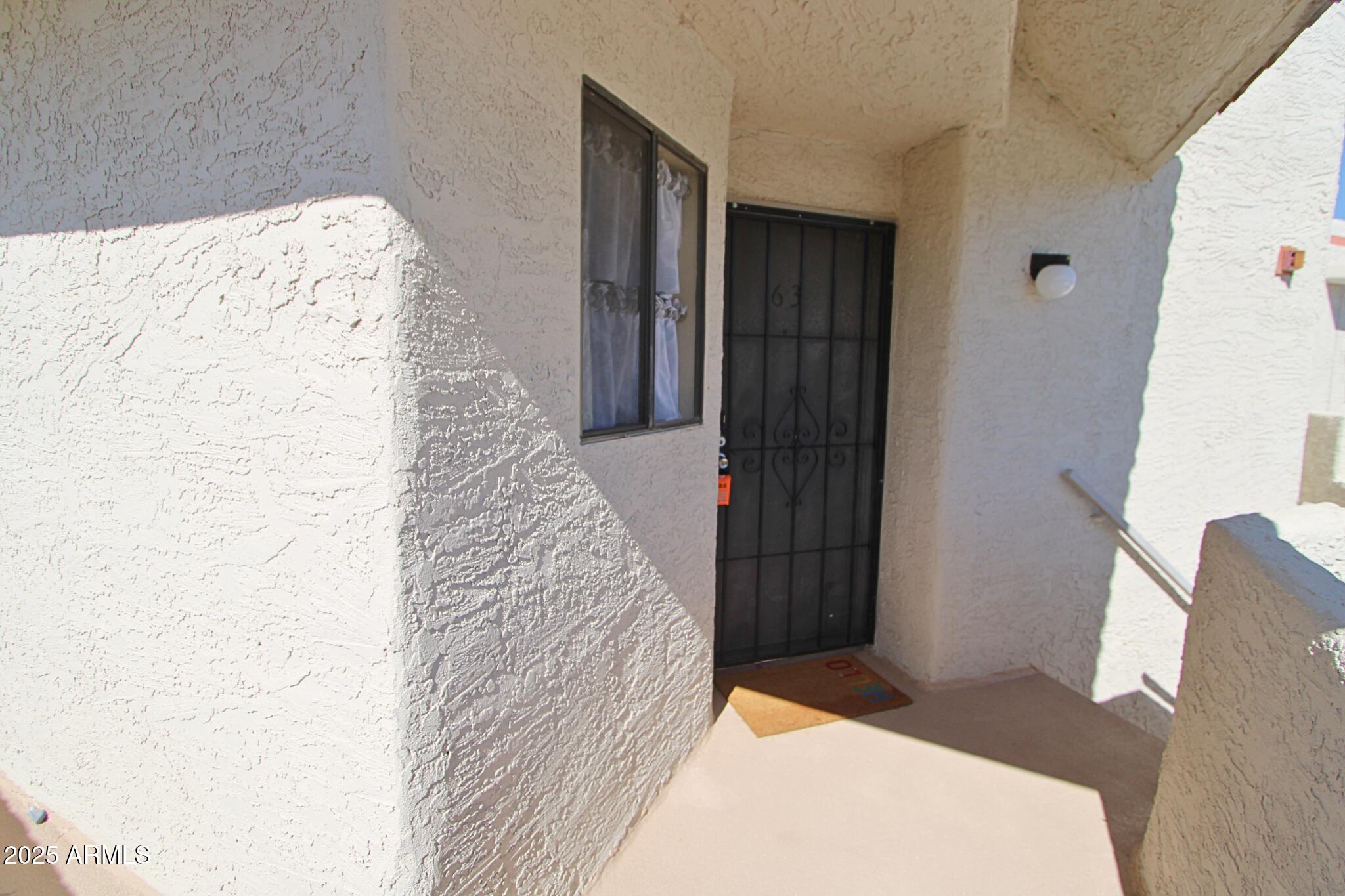 885 North Granite Reef Road, Unit 63 Scottsdale, AZ 85257 - Photo 2 of 23 a bedroom with a bed