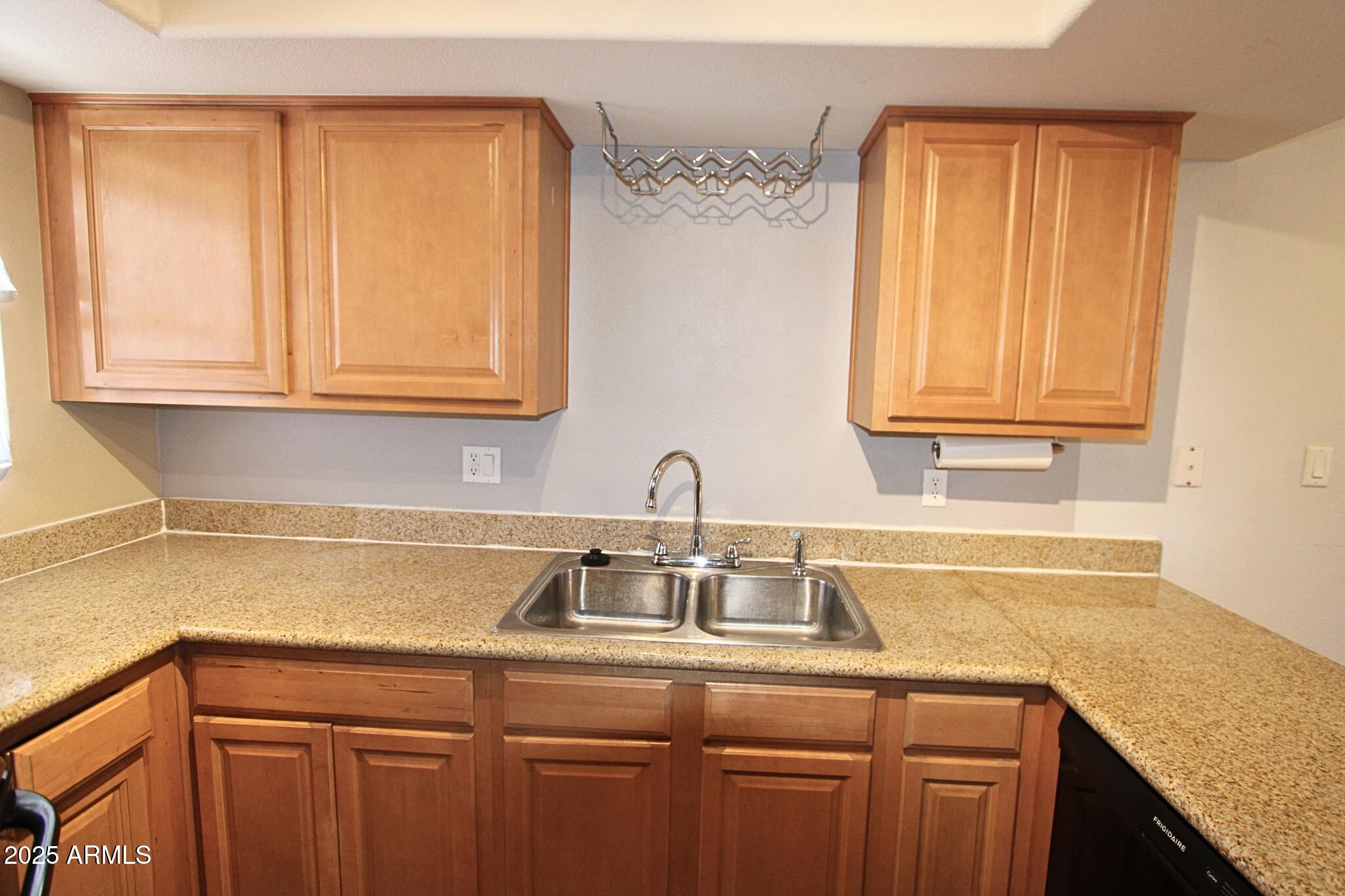 885 North Granite Reef Road, Unit 63 Scottsdale, AZ 85257 - Photo 5 of 23 a sink with a granite countertop window