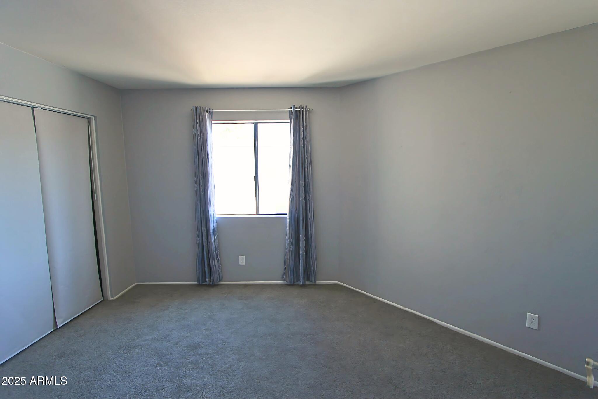 885 North Granite Reef Road, Unit 63 Scottsdale, AZ 85257 - Photo 8 of 23 an empty room with windows