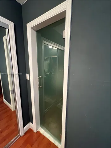 a bedroom with a bed and dresser