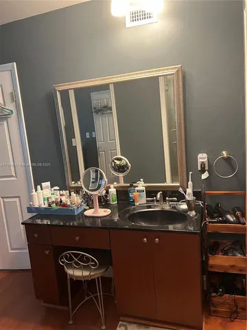 a bedroom with a bed and cabinets