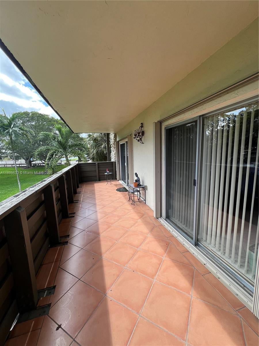 8335 Southwest 72nd Avenue, Unit 212D Miami, FL 33143 - Photo 26 of 31 a view of balcony with couch