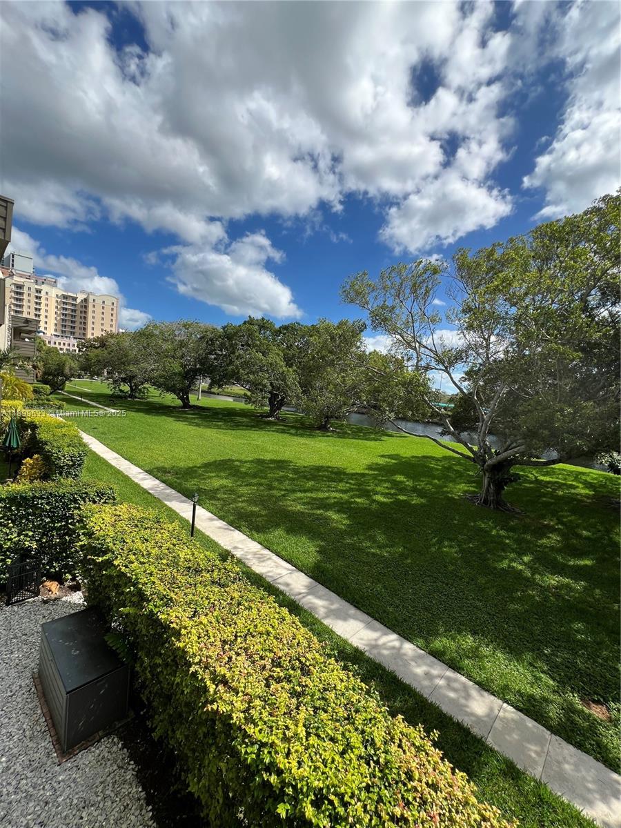 8335 Southwest 72nd Avenue, Unit 212D Miami, FL 33143 - Photo 31 of 31 a view of a garden with a building