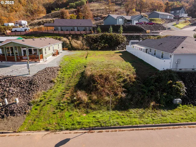 an aerial view of residential house with parking space