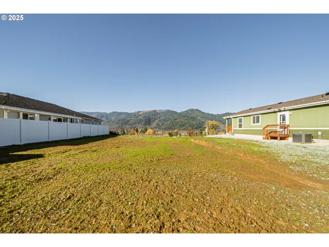 a view of an ocean with a mountain