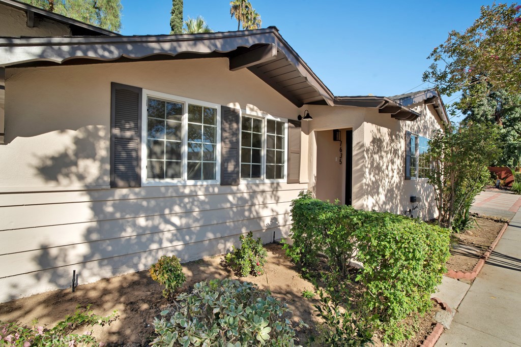 7635 Fallbrook Avenue West Hills, CA 91304 - Photo 1 of 26 a front view of a house with garden