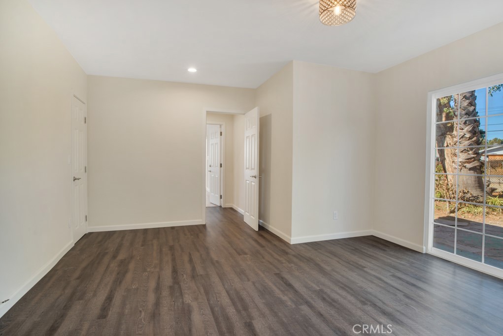 7635 Fallbrook Avenue West Hills, CA 91304 - Photo 11 of 26 a view of a room with wooden floor and window