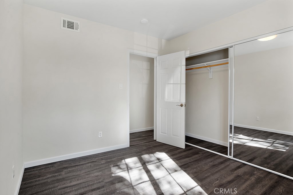 7635 Fallbrook Avenue West Hills, CA 91304 - Photo 14 of 26 a view of an empty room and wooden floor
