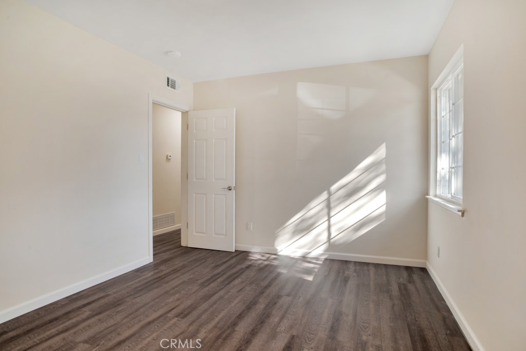 7635 Fallbrook Avenue West Hills, CA 91304 - Photo 16 of 26 a view of empty room with wooden floor and fan