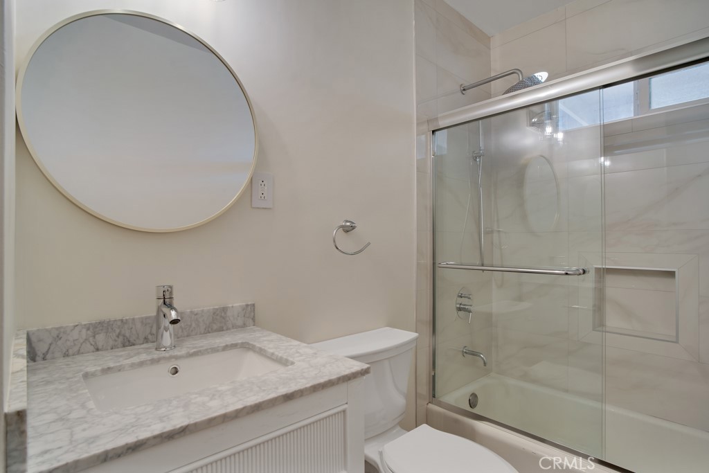 7635 Fallbrook Avenue West Hills, CA 91304 - Photo 17 of 26 a bathroom with a sink toilet and shower