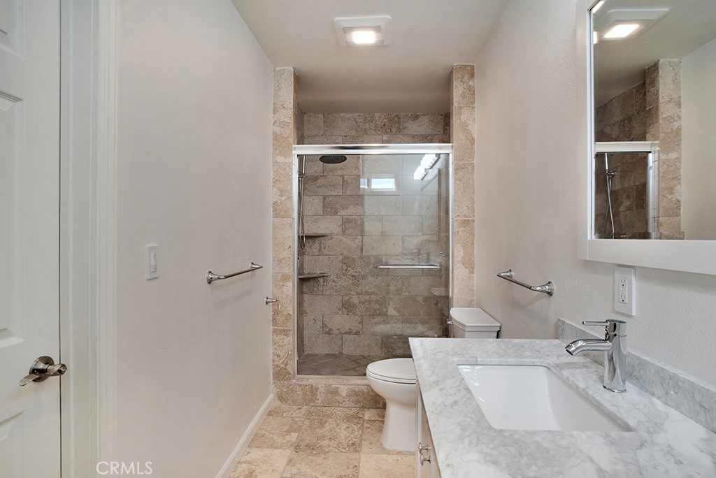 7635 Fallbrook Avenue West Hills, CA 91304 - Photo 20 of 26 a bathroom with a sink a toilet and shower