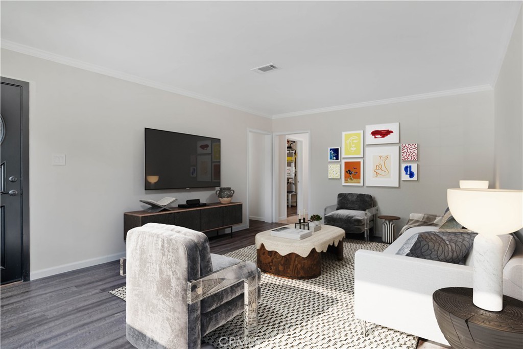 7635 Fallbrook Avenue West Hills, CA 91304 - Photo 2 of 26 a living room with furniture and a flat screen tv