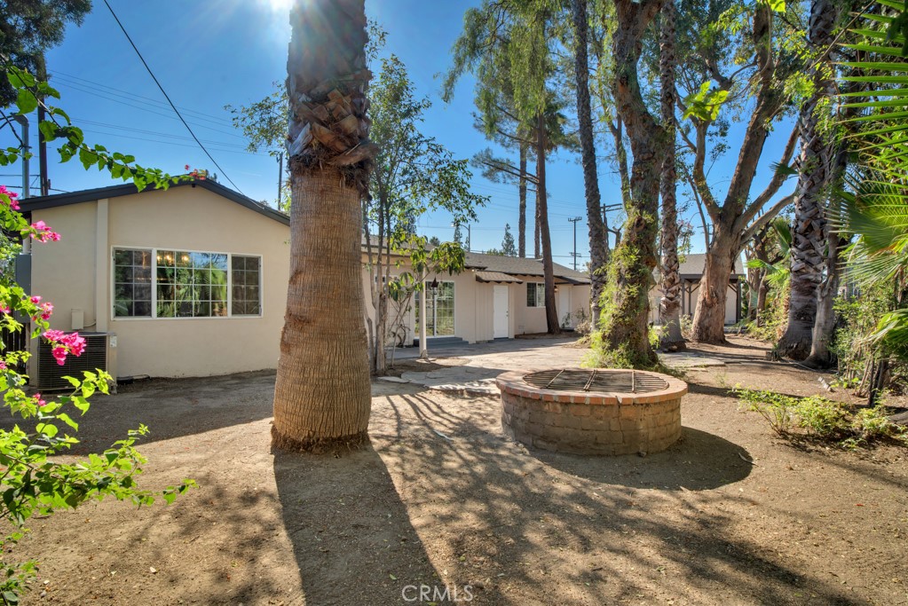 7635 Fallbrook Avenue West Hills, CA 91304 - Photo 22 of 26 a front view of a house with garden