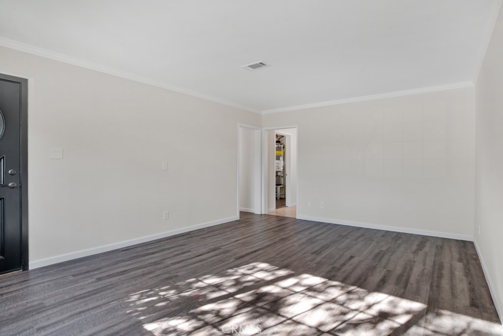 7635 Fallbrook Avenue West Hills, CA 91304 - Photo 3 of 26 a view of an empty room and wooden floor